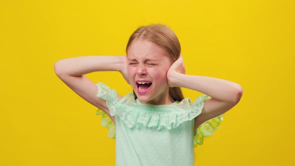 Studio Portrait of Displeased Preteen Girl Screaming Dramatically