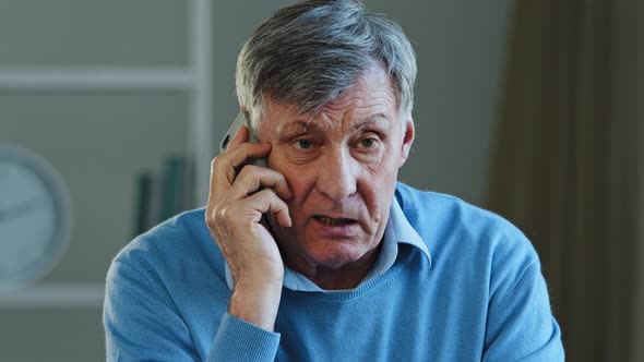 Closeup Lonely Pensioner Talking on Phone Dissatisfied Service Elderly Mature Man Yelling Deceived