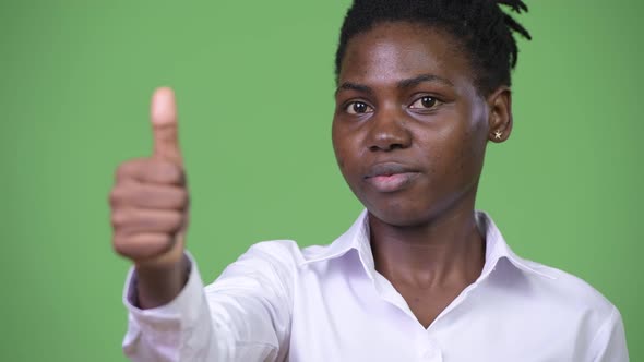 Young Beautiful African Businesswoman Giving Thumbs Up