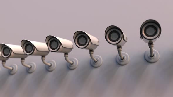 Line of Surveillance Cameras on the Wall