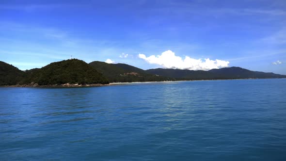 Looking at the sea, island and sky from the sea. (Slow motion - Angle 003)