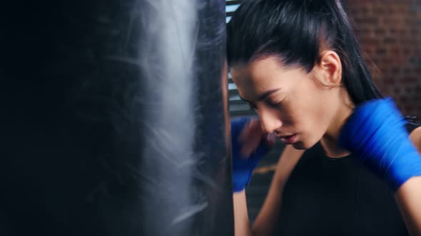 Closeup Fierce Aggressive Young Woman Kickboxer Hitting Punching Bag Angry After Losing Fighting