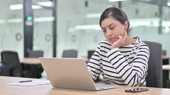 Indian Woman Working on Laptop in Office 