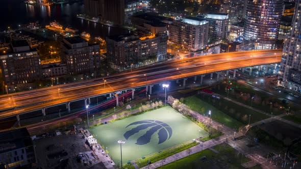 Sports Field with City Traffic and Condo Architecture Toronto at Night