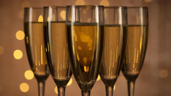champagne glasses over Holiday Bokeh Blinking background
