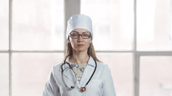 Portrait of a smiling lady doctor looking at camera