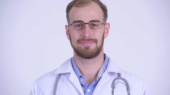 Face of Happy Bearded Man Doctor with Eyeglasses Smiling