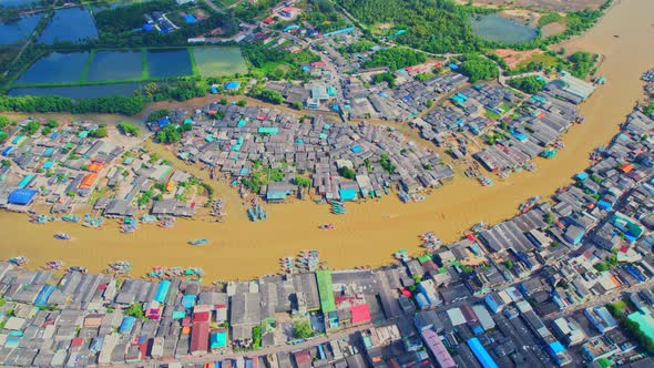 Drones are flying over Pak Nam Chumphon village during sunrise