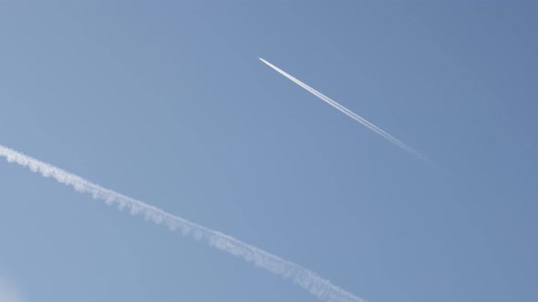 Condensation trails produced by  engine exhaust on the sky 3840X2160 UHD footage - Aircraft and chem