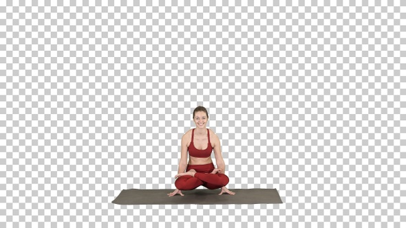 Young sporty woman practicing yoga doing Scale exercise, Tolasana