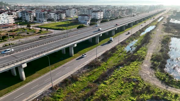 Traffic in the reflection of water aerial view 4 K