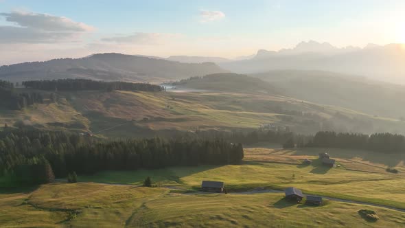 Sunrise in the Dolomites mountains with fog and mist