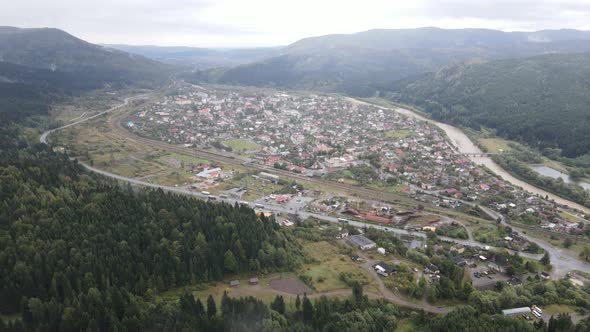 Village in the Carpathian Mountains in Autumn. Slow Motion, Aerial View