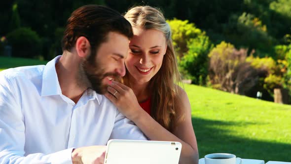 Couple using digital tablet in a restaurant 4k