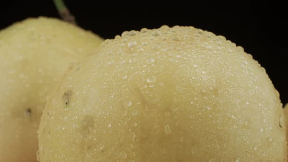 Passion fruit closeup with droplets of water