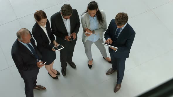 Business people using digital tablet and mobile phone