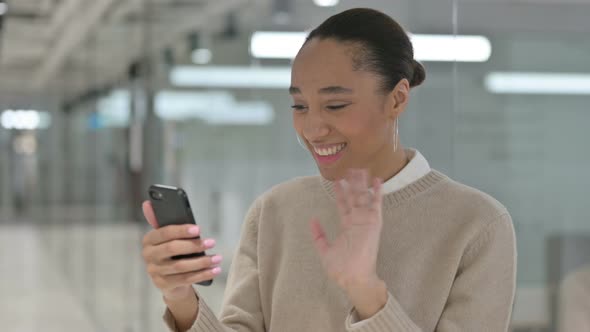 Creative African Woman Talking on Video Call on Smartphone