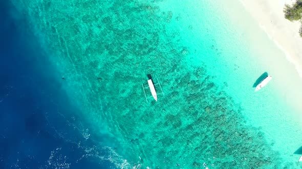 Aerial tourism of exotic island beach holiday by blue green sea and white sand background of a picni