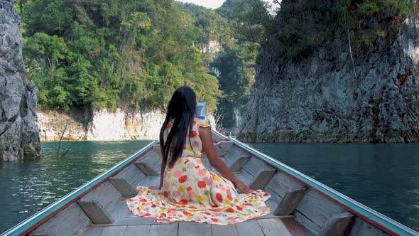 Khao Sok Thailand Woman on Vacation in Thailand Girl in Longtail Boat at the Khao Sok National Park