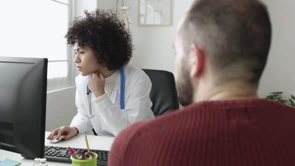 Doctor and Patient Talking in a Medical Consultation in a Clinic