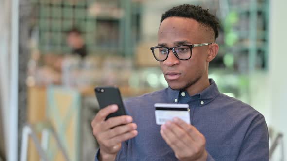 African Woman Using Smartphone at Work