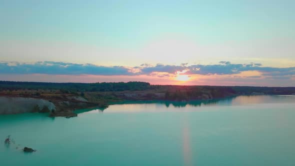 An artificial lake in chalk quarry. view from drone. Turquoise water background