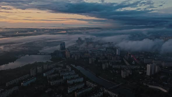 Aerial Panoramic View of Dark City After Rain and Sunset Cloudy Sky Smog Riverscape and Tenement