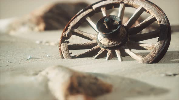 Large Wooden Wheel in the Sand