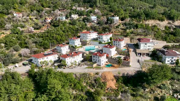 Complex of villas in the mountains aerial view 4 K