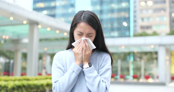 Woman runny nose at outdoor