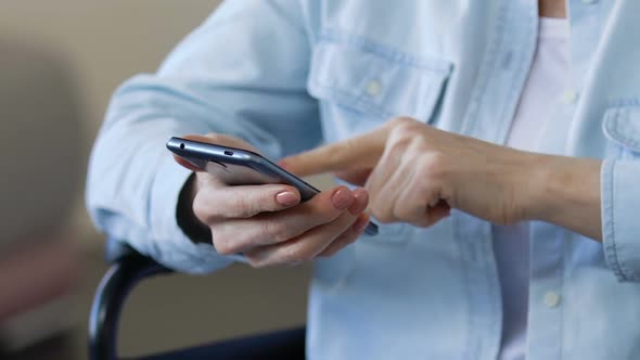 Mature Lady Scrolling Smartphone, Viewing Photos From Her Past, Using Gadget