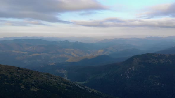 Cloudy Sunset Sky and Mountains