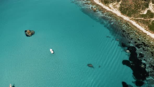 The Cliff and the Calm Sea in Summer in Calabria at Capo Vaticano