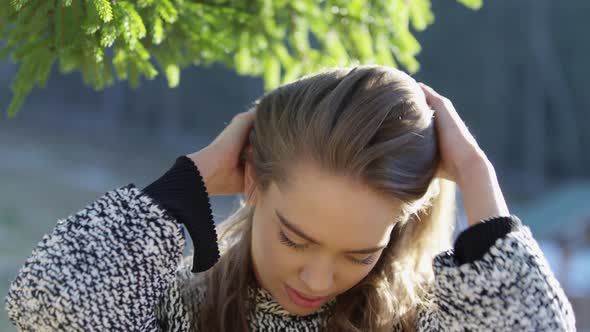 Young woman playing with her hair