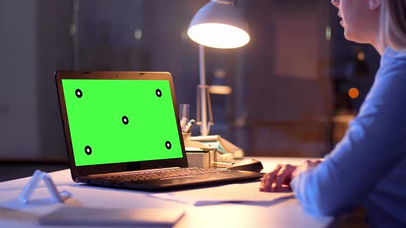 Businesswoman with Green Screen on Laptop at Night 73