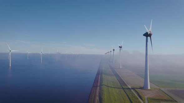 Offshore Windmill Park with Clouds and a Blue Sky Windmill Park in the Ocean Drone Aerial View with