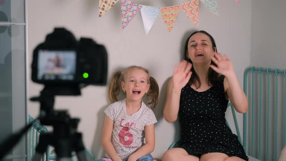 Little Girl and Mom Shooting Content for Internet