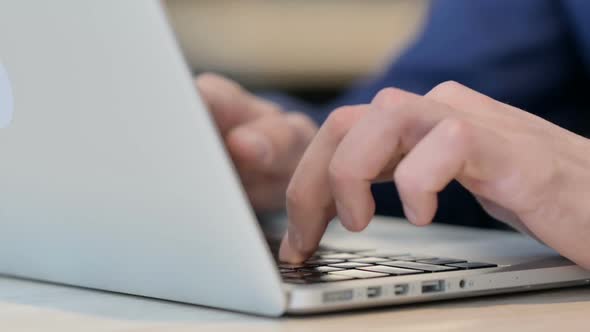 Close Up of Hands Typing on Laptop