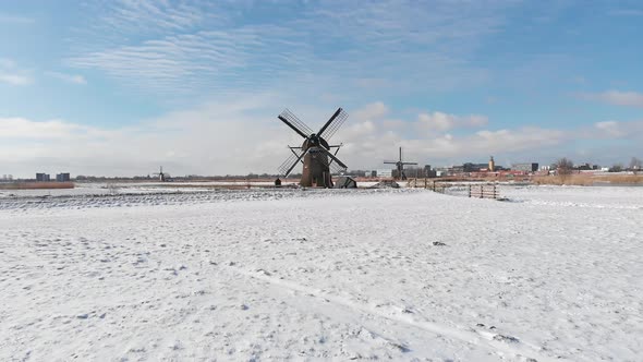 Traditional winter Dutch scene, winter snow covering windmills and polder land