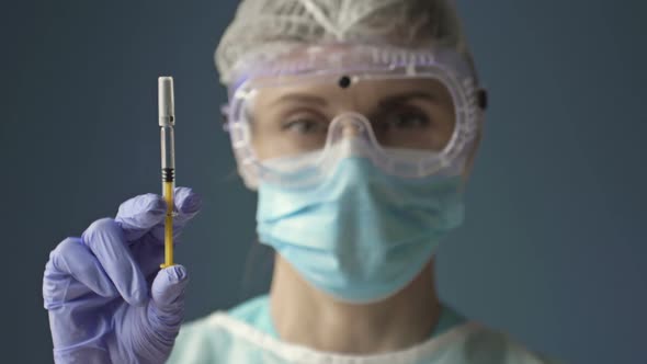 Syringe with COVID19 Vaccine in the Hands of a Nurse