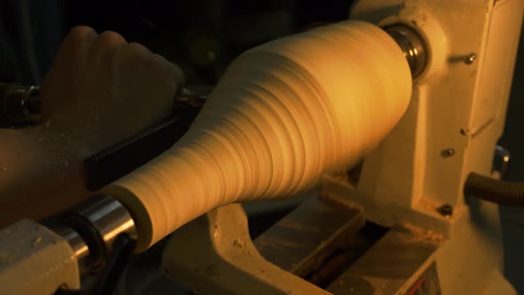 Carpenter Working At Wood Lathe