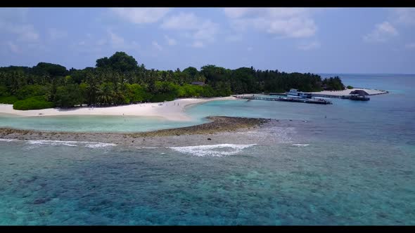 Aerial drone shot abstract of tranquil island beach trip by turquoise ocean with white sandy backgro