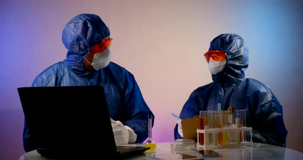 Virologists Dressed in Protective Suits Are Exploring Coronavirus in Laboratory