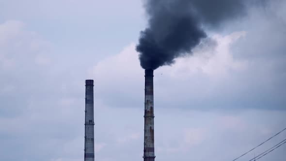 Factory pipes with smoke. Smoke of pipes pollutes atmosphere