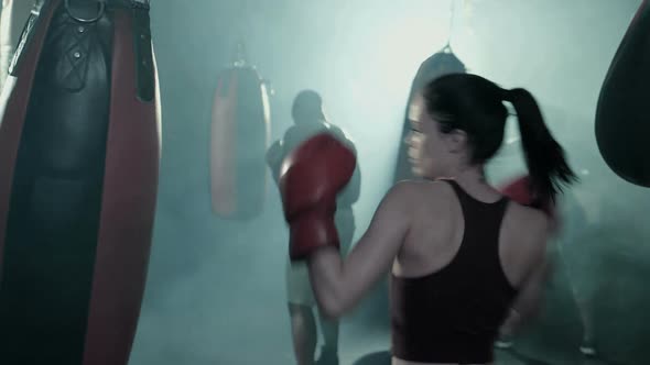 Group of Boxers Training in a Group. Female in the foreground.