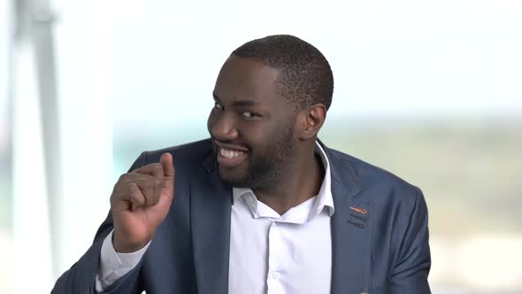 Funny Man in Business Suit on Blurred Background