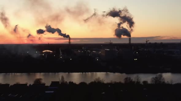  Smoking Stack in Sunrise. Air Pollution and Climate Change Theme. Poor Environment in the City