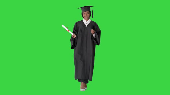 Young African Graduate Student Walking and Laughing on a Green Screen, Chroma Key.