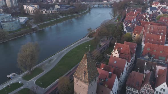 Ulm Metzgerturm Tower And Danube River With Drone At Sunrise