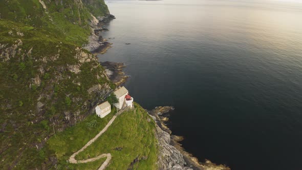 Hendanes Lighthouse At The Mountainside on Vestland County, Norway. aerial